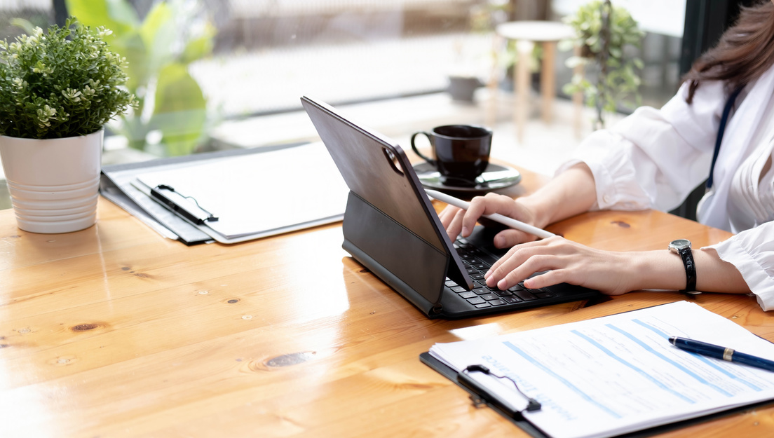 Close up Business Woman Using Calculator and Laptop for Do Math